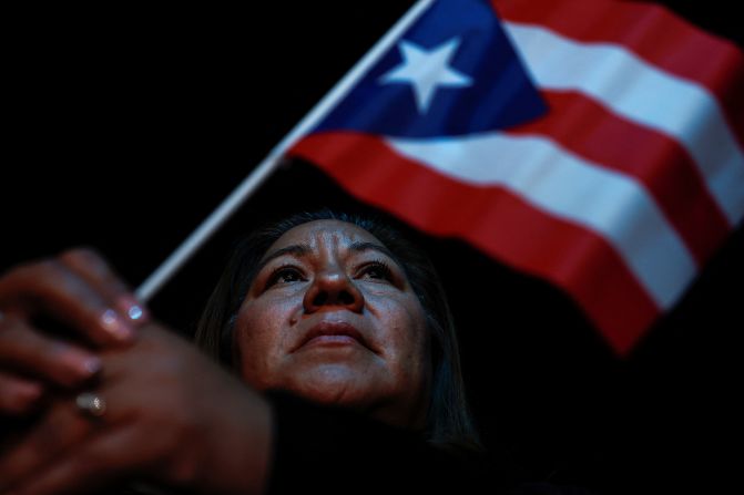 Areli Sanchez holds a Puerto Rican flag during a Harris campaign rally in North Las Vegas, Nevada, on October 31. Puerto Rico has been in the headlines since a comedian at a Trump rally made comments <a href=