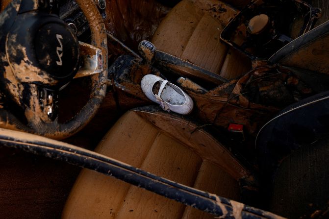 A shoe lies inside a damaged car in Alfafar on Saturday.