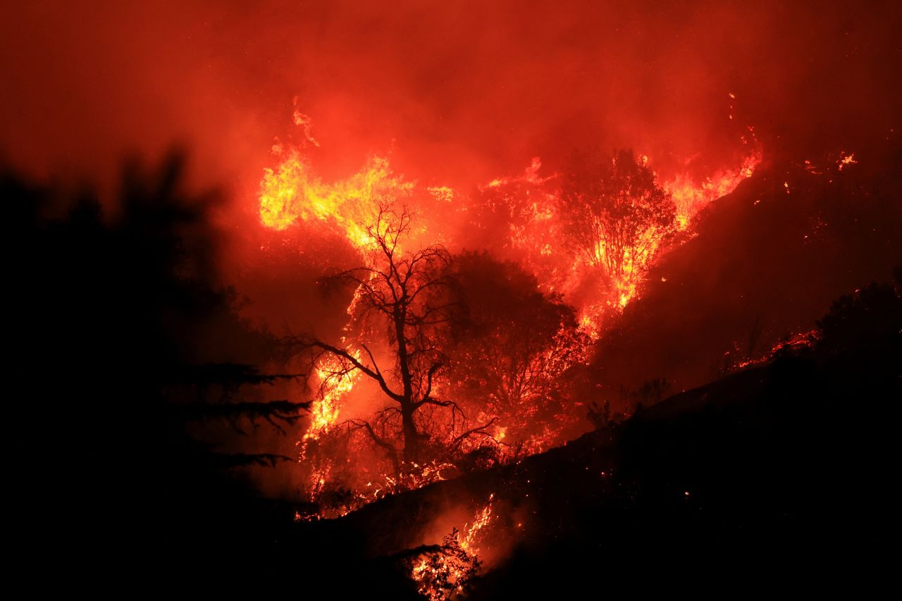 Smoke and flames billow from the Mountain Fire in Santa Paula, California on November 6.