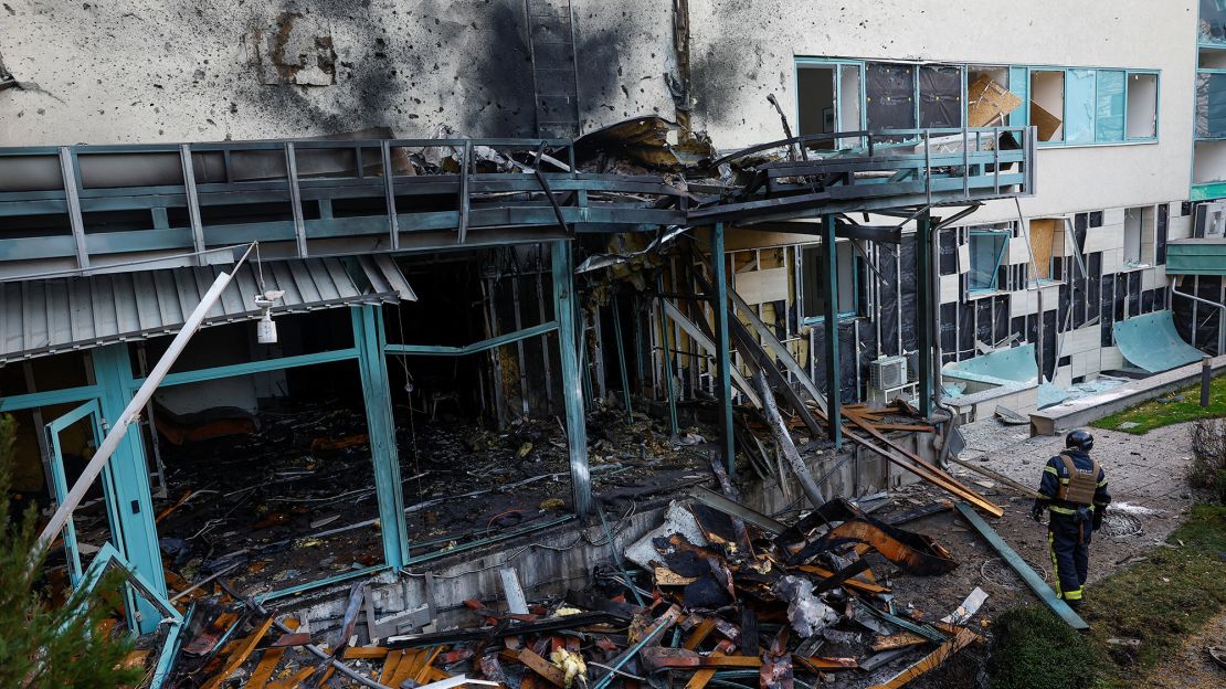 A firefighter assesses the damage to a medical centre in Kyiv, Ukraine, on November 7, after a Russian drone strike.