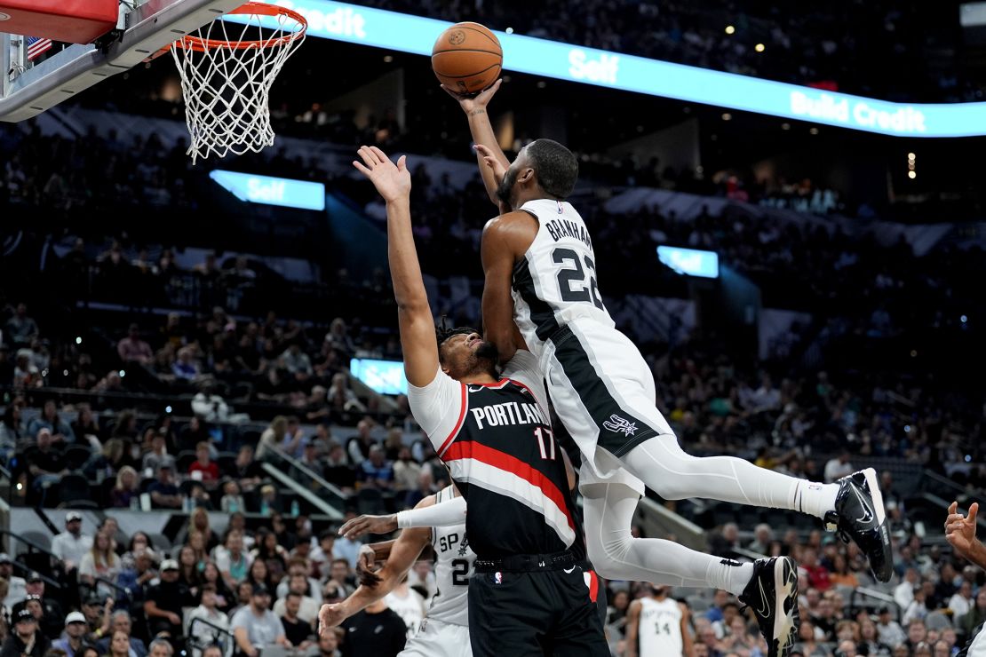 San Antonio Spurs guard Malaki Branham shoots over Portland Trail Blazers guard Shaedon Sharpe in the first half at Frost Bank Center.