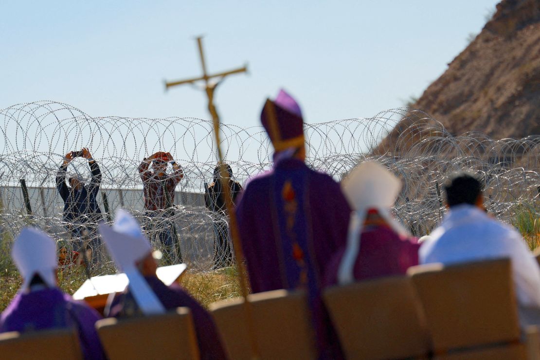 Members of the Catholic Church hold a binational Mass in memory of migrants who died during their journey to the US at the Mexico-US border, as seen from Ciudad Juarez, Mexico, on November 9, 2024.