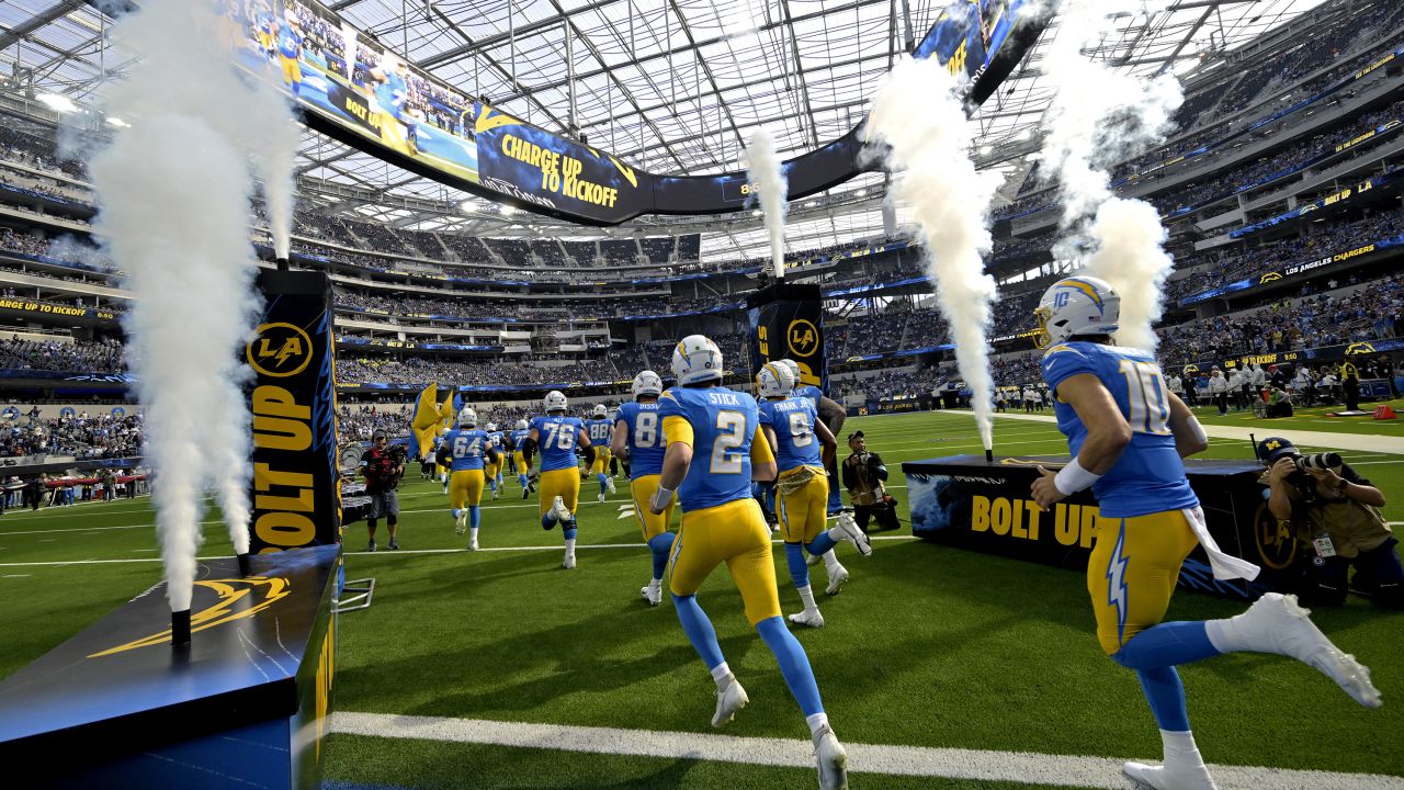 Nov 10, 2024; Inglewood, California, USA; Los Angeles Chargers players run on to the field for the game against the Tennessee Titans at SoFi Stadium. Mandatory Credit: Jayne Kamin-Oncea-Imagn Images