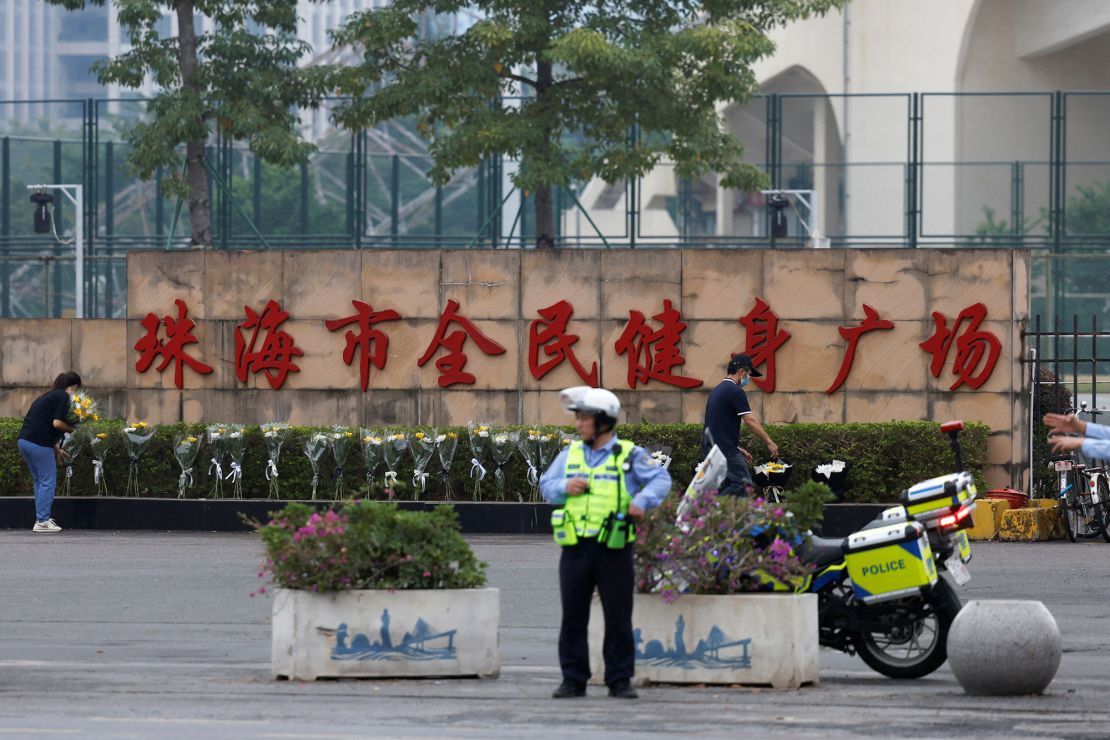 A police officer keeps watch outside the sports center in Zhuhai on November 13, 2024.