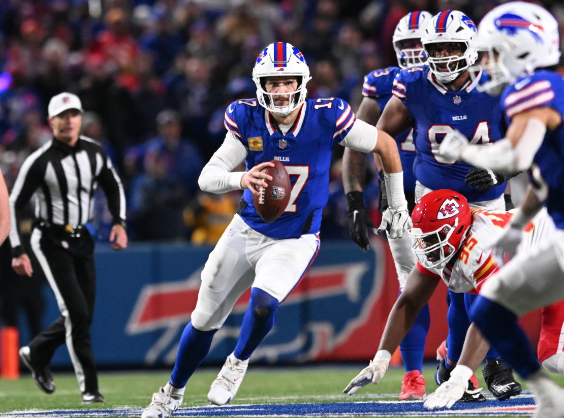 November 17, 2024; Orchard Park, New York, USA; Buffalo Bills quarterback Josh Allen (17) runs for a first down in the second quarter against the Kansas City Chiefs at Highmark Stadium. Mandatory attribution: Mark Konezny-Imagn Images