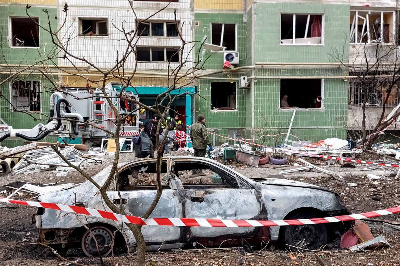 A destroyed car in front of a residential building that was damaged by a Russian missile strike in Sumy, Ukraine, on November 18.