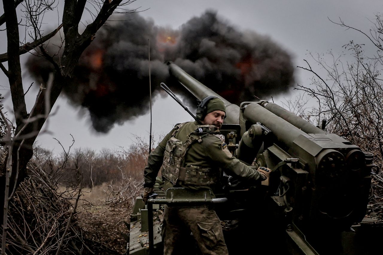 A serviceman of the Ukrainian Armed Forces fires a howitzer toward Russian troops at a front line near the town of Chasiv Yar in Donetsk region, Ukraine, on November 18, 2024.