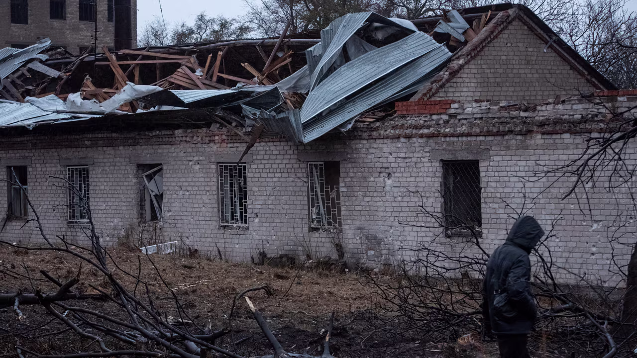A resident walks at the site of a Russian missile strike in Dnipro, Ukraine, November 21.