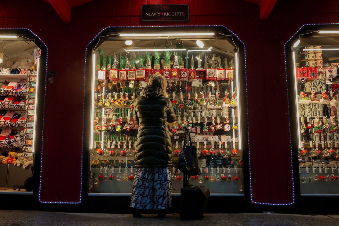 A woman looks at holiday ornaments at a pop-up holiday shop in New York City, on November 21.