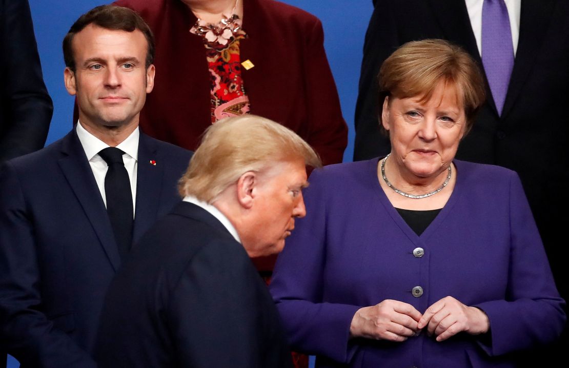 French President Emmanuel Macron and Merkel look at Trump during a summit in Watford, United Kingdom, December 4, 2019.