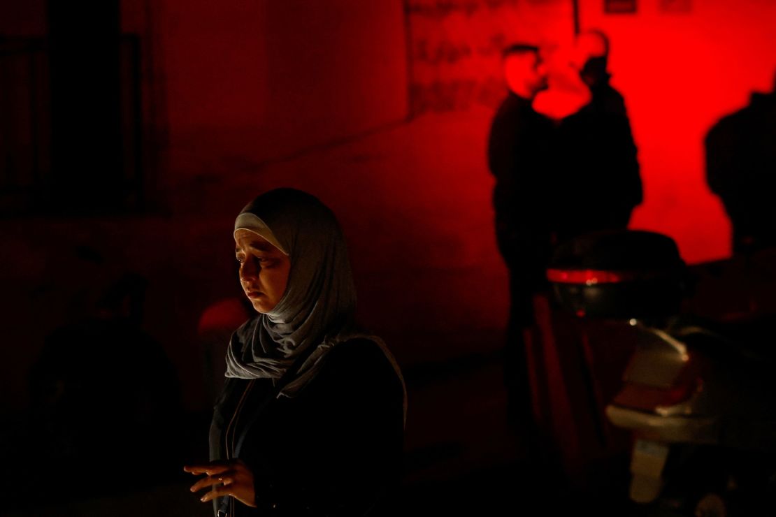 A woman at the site of the Israeli strike in the Basta neighborhood of Beirut, Lebanon.