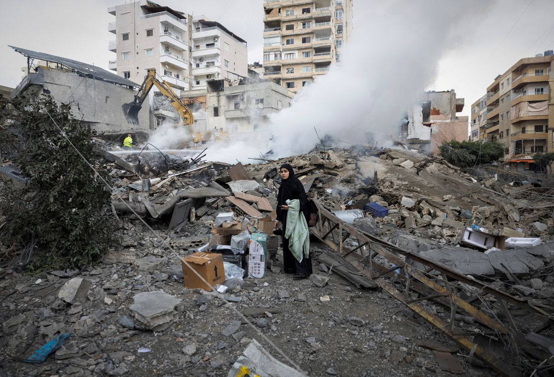 A woman searches for her belongings among the rubble of a destroyed building in the city of Tire after a ceasefire took effect between Israel and the Iranian-backed group Hezbollah in late November 2024. Reuters/Adnan Abidi TPX Picture of the Day