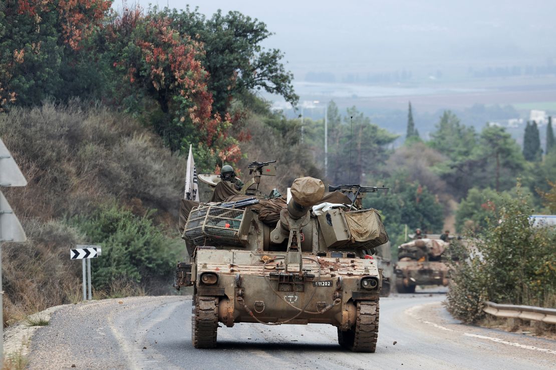 An Israeli soldier rides in a military vehicle, after a ceasefire was agreed by Israel and Iran-backed Hezbollah in Lebanon, near the border between the two countries on Wednesday.