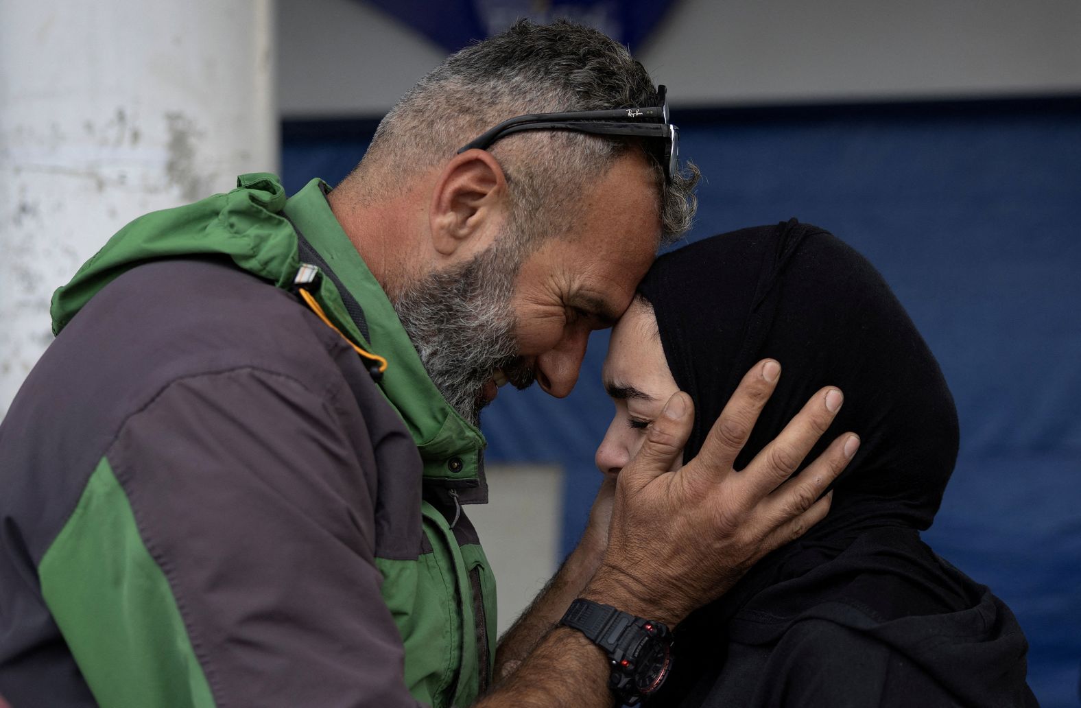 Batoul Mohammed Sleem cries as her father Mohammed Sleem hugs her, as they meet after two months, according to Mohammed, after a ceasefire between Israel and Iran-backed group Hezbollah took effect at 0200 GMT on Wednesday after U.S. President Joe Biden said both sides accepted an agreement brokered by the United States and France, in Tyre, Lebanon, November 27, 2024. REUTERS/Adnan Abidi TPX IMAGES OF THE DAY