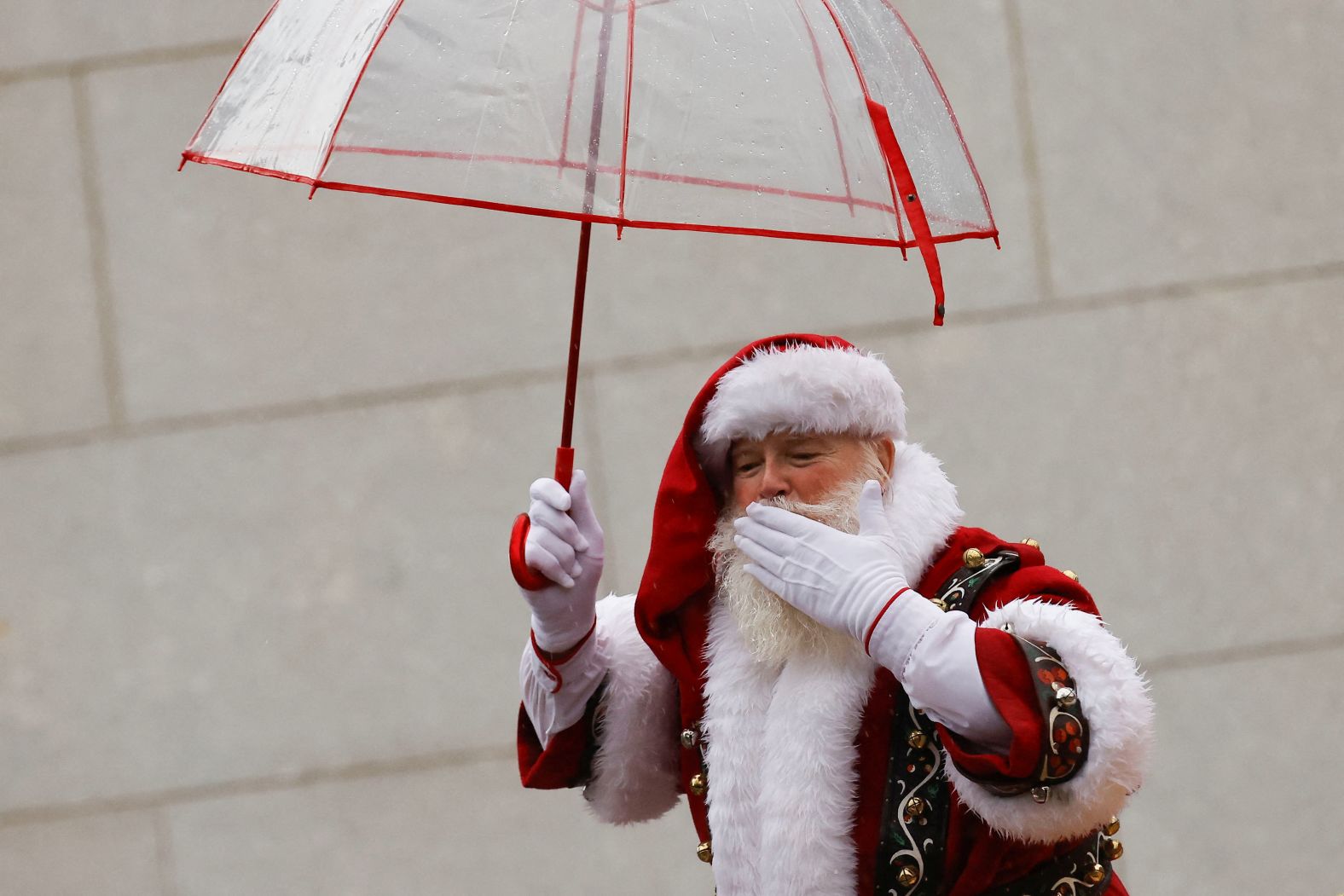 A man dressed as Santa Claus gestures during the parade in New York.