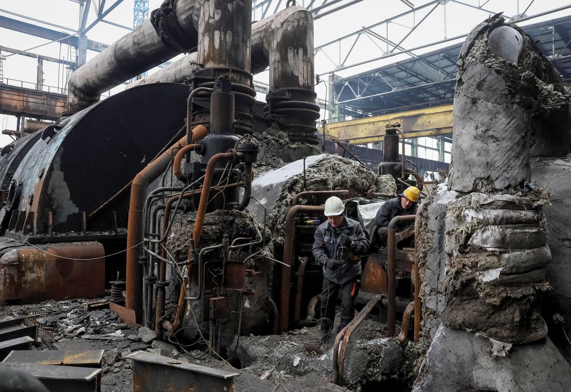 Workers fix a thermal power plant damaged by a Russian missile strike in Ukraine on November 28, 2024.