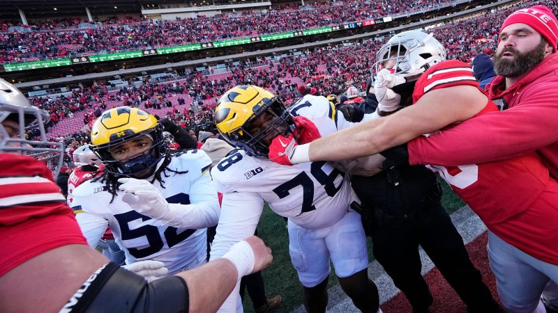 ‘Unsportsmanlike’ flag planting causes chaos over college football rivalry weekend | CNN