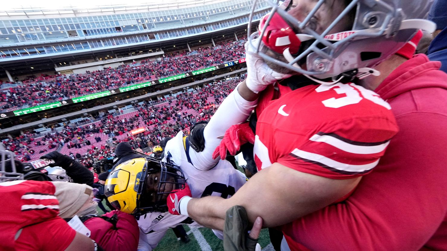 Brawl ensues after Michigan deals stunning upset loss to rival Ohio