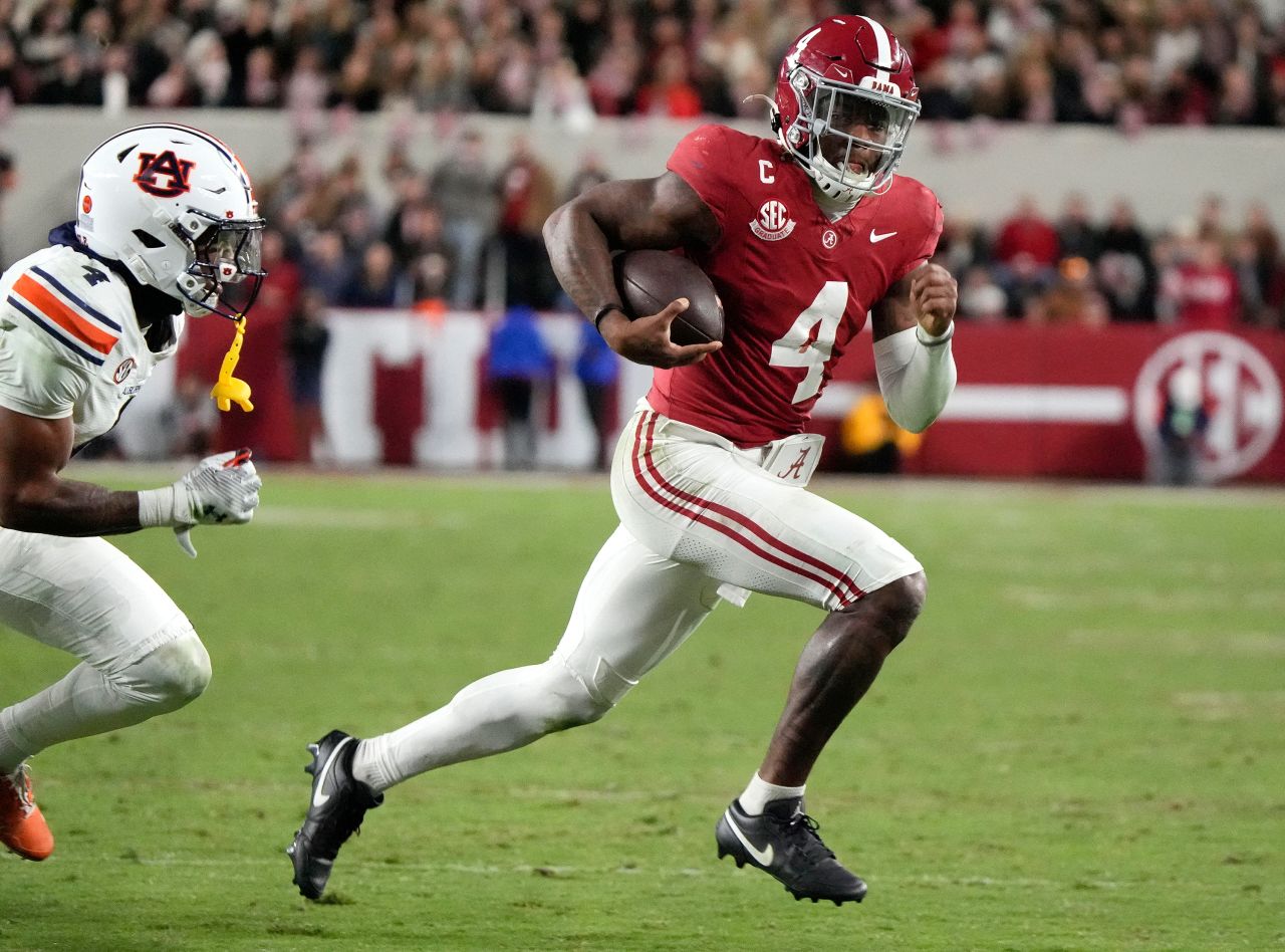 Alabama quarterback Jalen Milroe runs for a touchdown during a game against Auburn in Tuscaloosa, Alabama, on November 30.