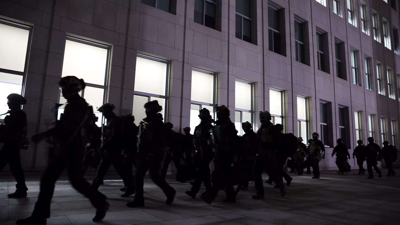 Military forces move outside the National Assembly in Seoul, South Korea, on December 4, after President Yoon Suk Yeol declared martial law.