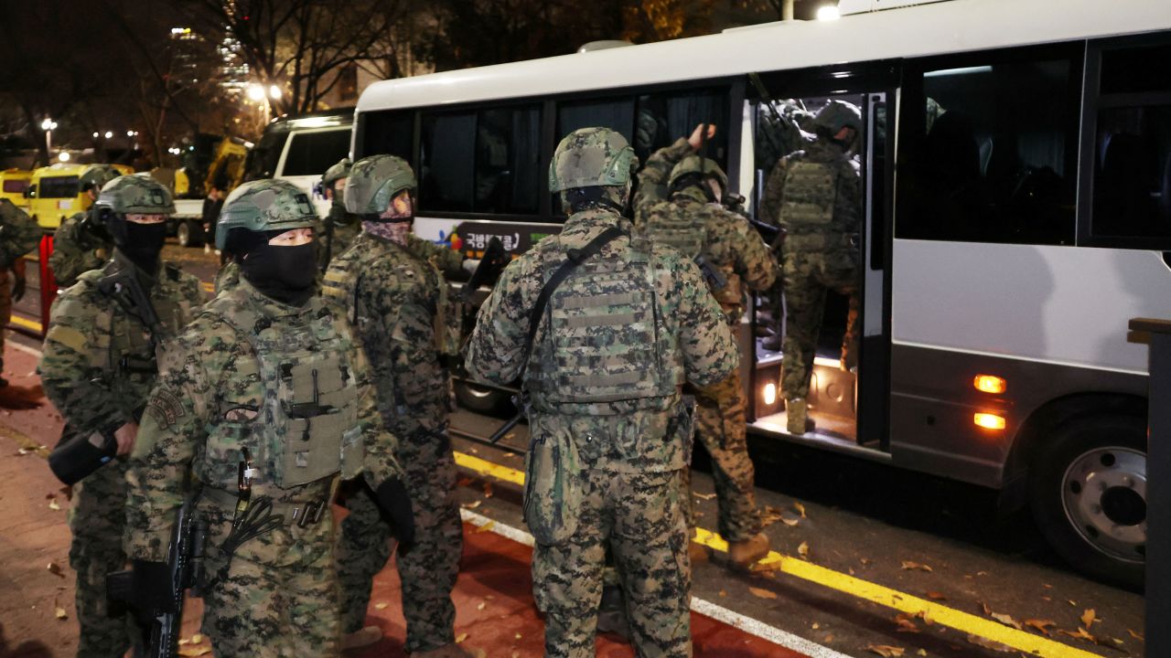 Soldiers leave the National Assembly after South Korea's parliament passed a motion requiring the martial law declared by President Yoon Suk Yeol to be lifted in Seoul, South Korea, December 4, 2024. Yonhap via REUTERS THIS IMAGE HAS BEEN SUPPLIED BY A THIRD PARTY. NO RESALES. NO ARCHIVES. SOUTH KOREA OUT. NO COMMERCIAL OR EDITORIAL SALES IN SOUTH KOREA.