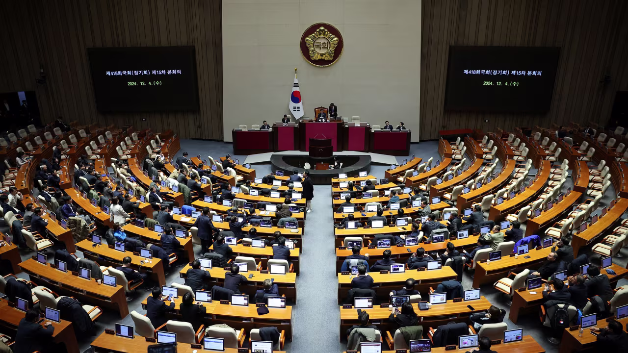 Lawmakers sit inside the hall at the National Assembly, after South Korean President Yoon Suk Yeol declared martial law on December 4.