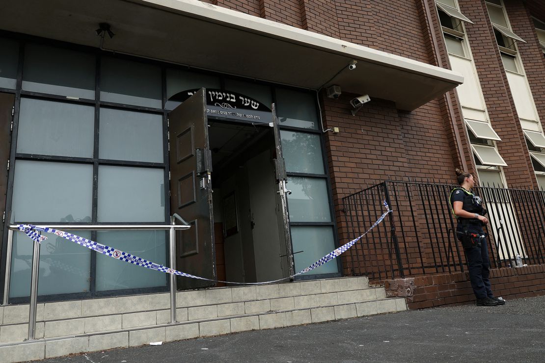 A female police officer stands guard at the scene of a fire at Adas Israel Synagogue in Ripponlea, Melbourne, Australia, on December 6, 2024.