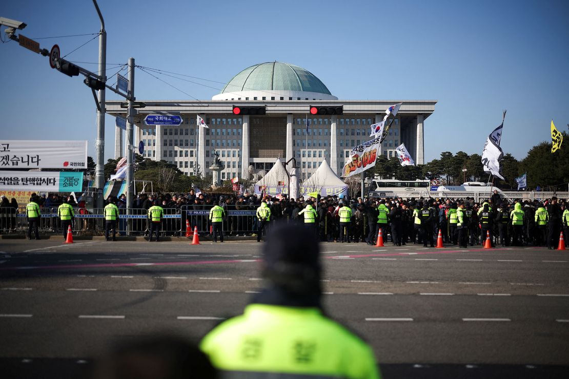 Protesters rally in front of the National Assembly in Seoul, South Korea, calling for the impeachment of South Korean President Yoon Suk Yeol, on December 7.