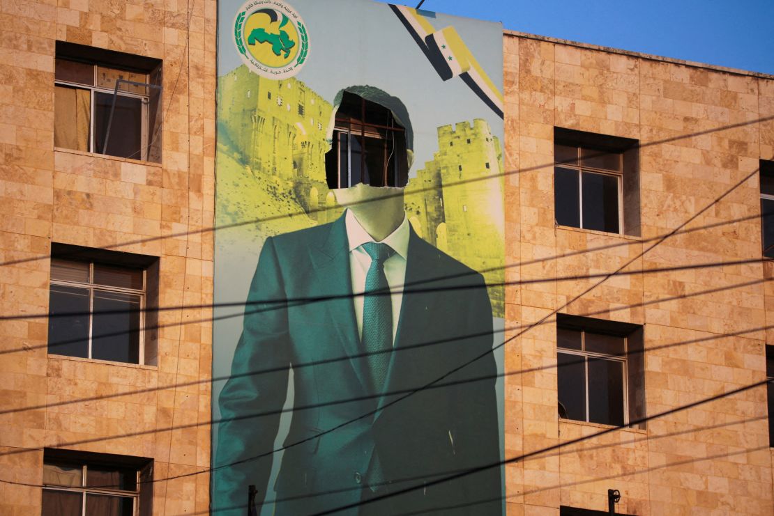 Posters of former Syrian President Bashar al-Assad were destroyed as rebel forces swept across the country.