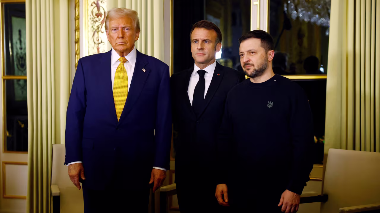 French President Emmanuel Macron poses with U.S. President-elect Donald Trump and Ukraine's President Volodymyr Zelenskiy before a trilateral meeting at the Elysee Palace in Paris as part of ceremonies to mark the reopening of the Notre-Dame de Paris Cathedral, five-and-a-half years after a fire ravaged the Gothic masterpiece, after its restoration, in Paris, France, December 7, 2024. REUTERS/Sarah Meyssonnier/Pool