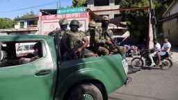 Members of the Haitian Armed Forces patrol the area as people flee homes following the armed gangs violence over the weekend, many grouped behind an alliance known as Viv Ansanm, at the Poste Marchand suburb, in Port-au-Prince, Haiti December 9, 2024.