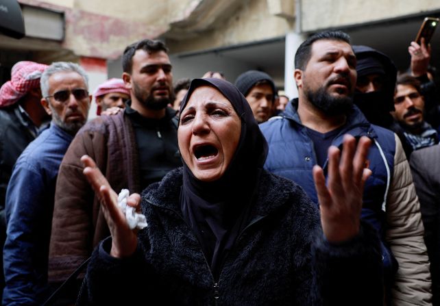 People react as they search for prisoners at Sednaya prison, Syria, on December 11.