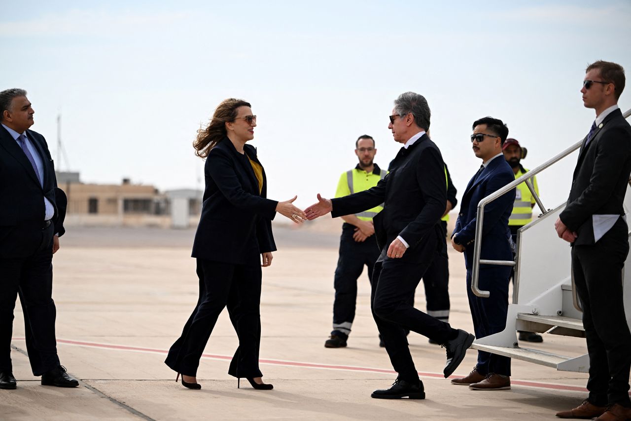 Ambassador of the United States to Jordan Yael Lempert, center left, shakes hands with US Secretary of State Antony Blinken, center right, upon his arrival in Aqaba, Jordan, on December 12.