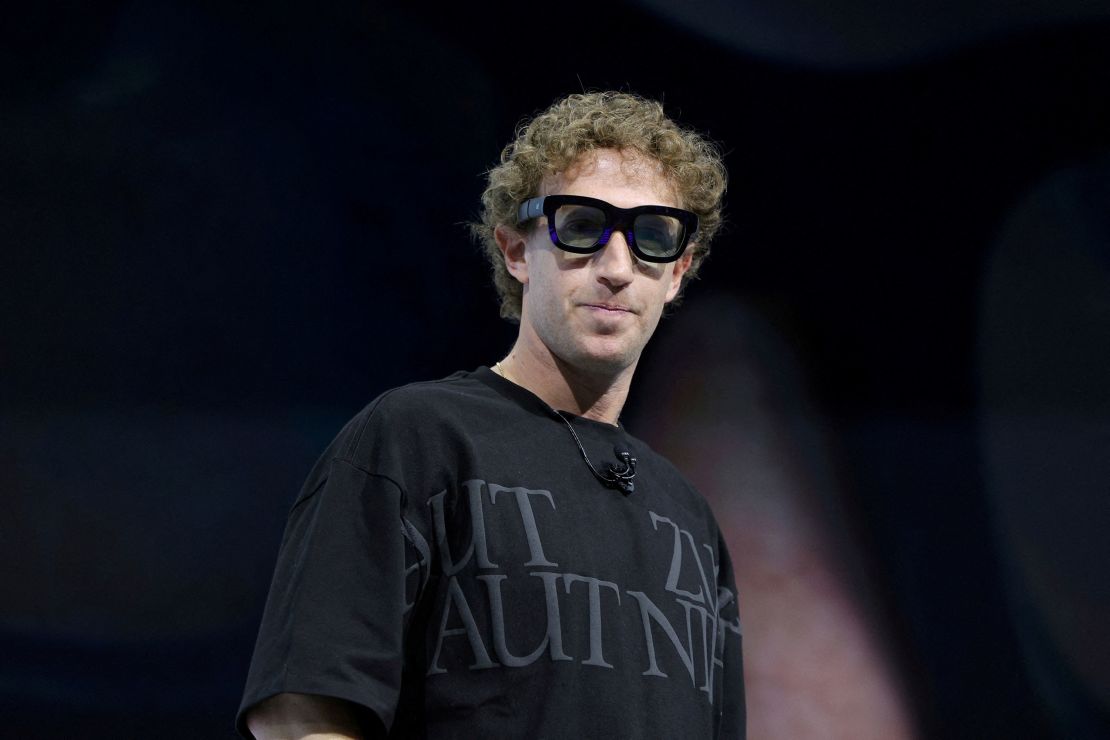 Meta CEO Mark Zuckerberg tries on Orion AR glasses at the Meta Connect annual event at the company's headquarters in Menlo Park, California, in September 2024.