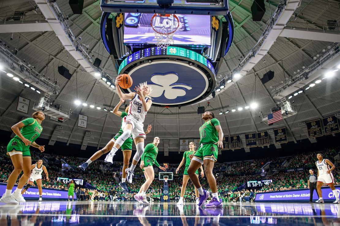 South Bend, Indiana: Connecticut Huskies guard Paige Bueckers (5) goes up for a shot as Notre Dame Fighting Irish guard Hannah Hidalgo (3) defends in the second half at the Purcell Pavilion on December 12.