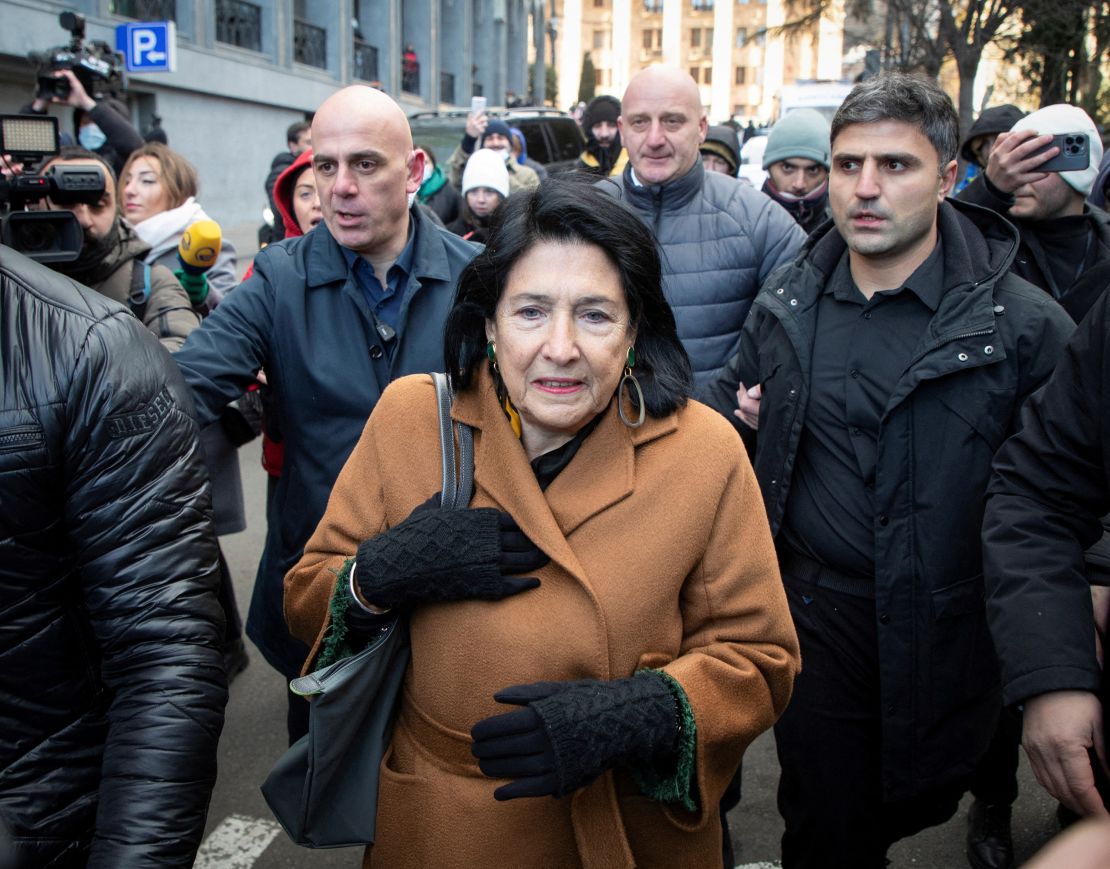 Outgoing President Salome Zurabichvili walks outside Parliament House as lawmakers vote to elect a new president.