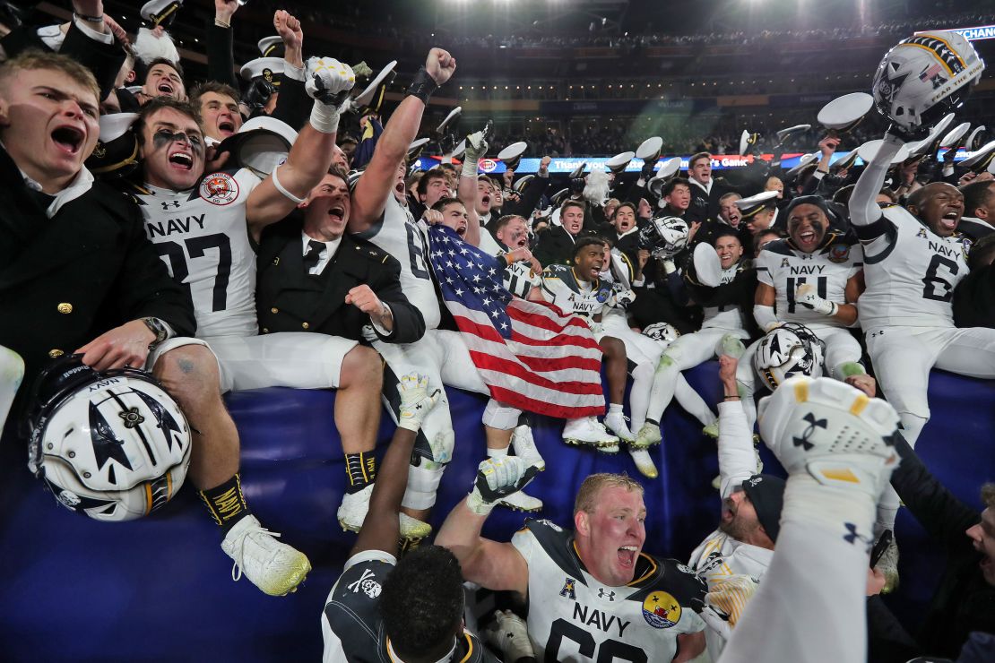 The Midshipmen celebrate the upset win over the Black Knights in the 125th edition of the Army-Navy game.