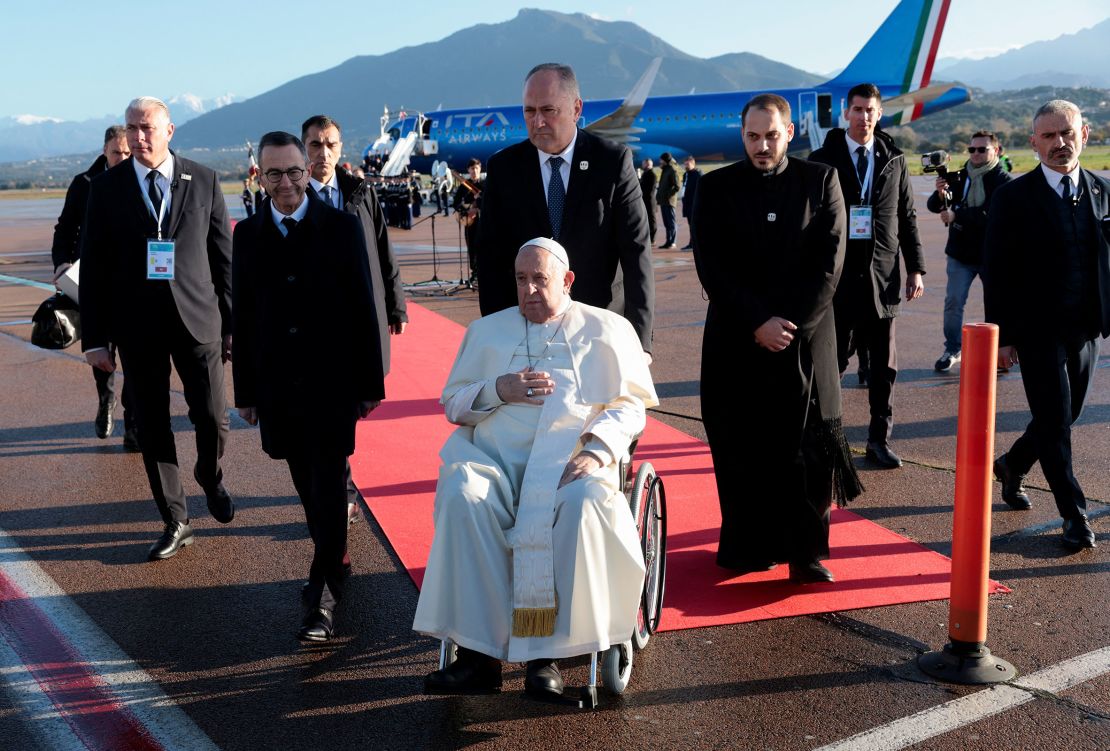 Pope Francis is welcomed at the Ajaccio Napoleon Bonaparte Airport during his apostolic journey in Ajaccio, Corsica, Sunday.