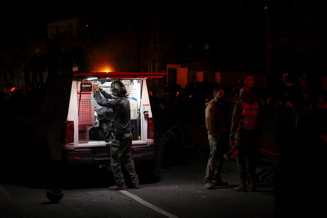 Israeli police bomb squad members work near a damaged site after a projectile fired from Yemen was intercepted, in Ramat Gan, Israel on December 19, 2024.