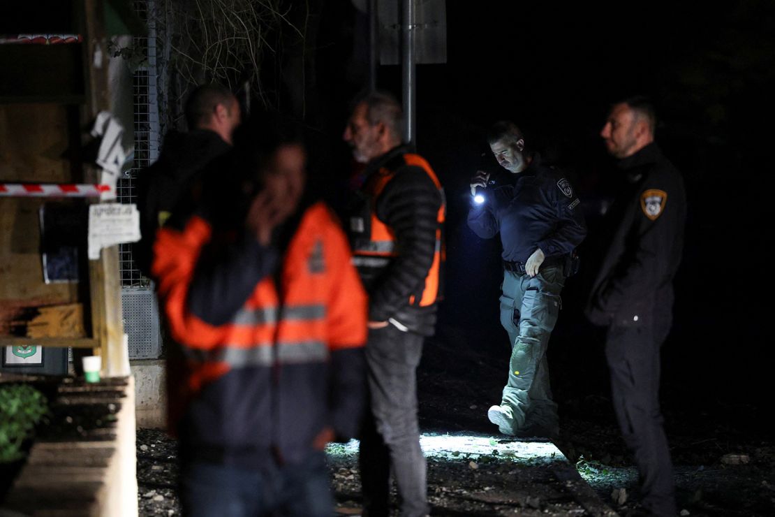 Israeli police bomb squad members work near a damaged site after a projectile fired from Yemen was intercepted, in Ramat Gan, Israel on December 19, 2024.