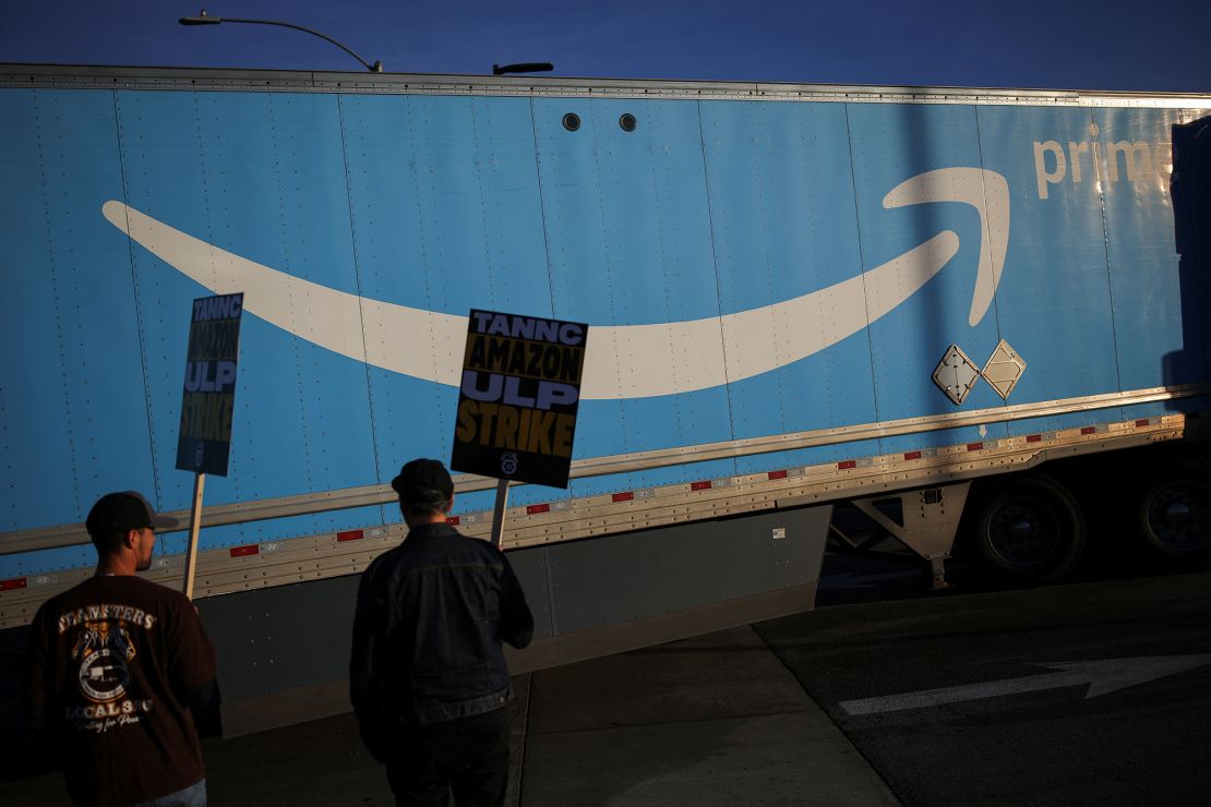 Striking workers picket outside of the Amazon DAX5 warehouse, in City of Industry, California, on December 19.