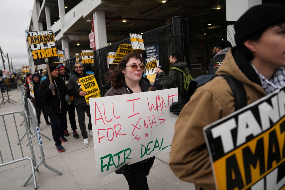 Amazon workers and supporters take part in a strike organised by the Teamsters union at the Amazon facility in the Queens borough of New York City on December 20.