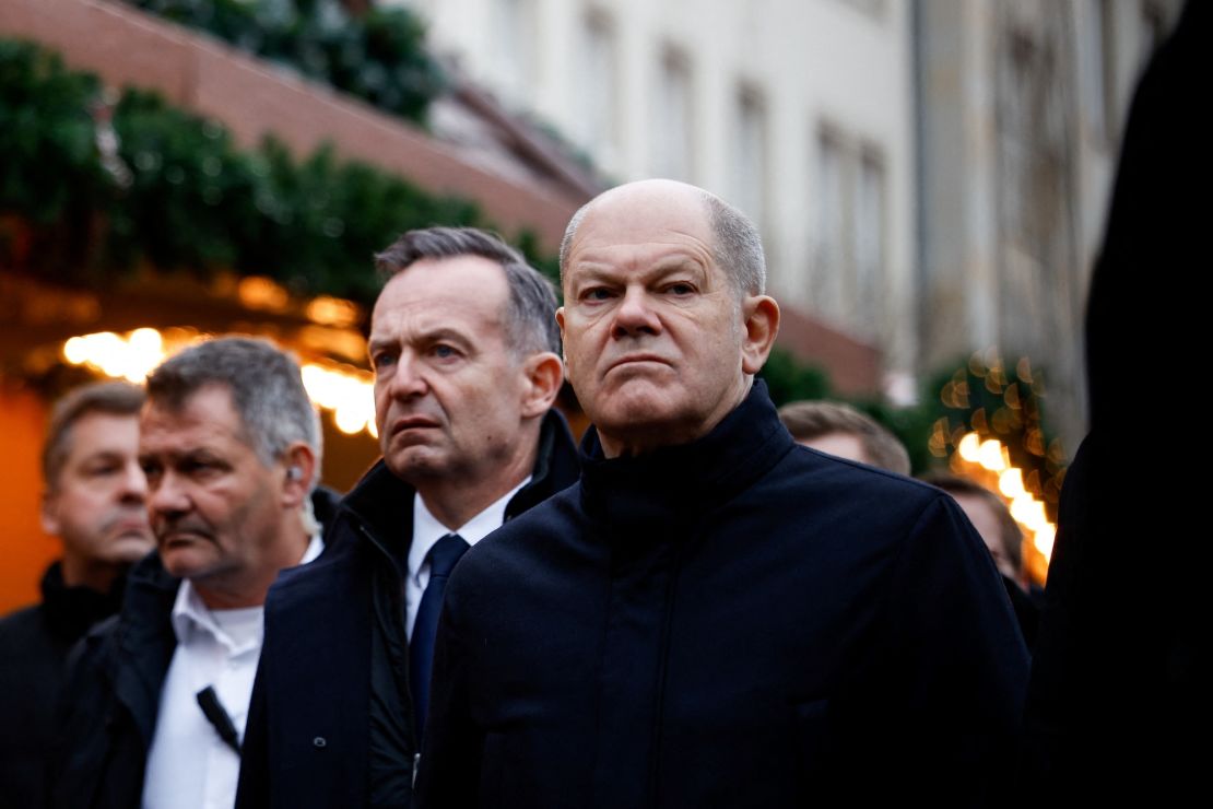 German Chancellor Olaf Scholz visits the site where a car drove into a crowd of a Christmas market in Magdeburg, Germany, on Saturday.