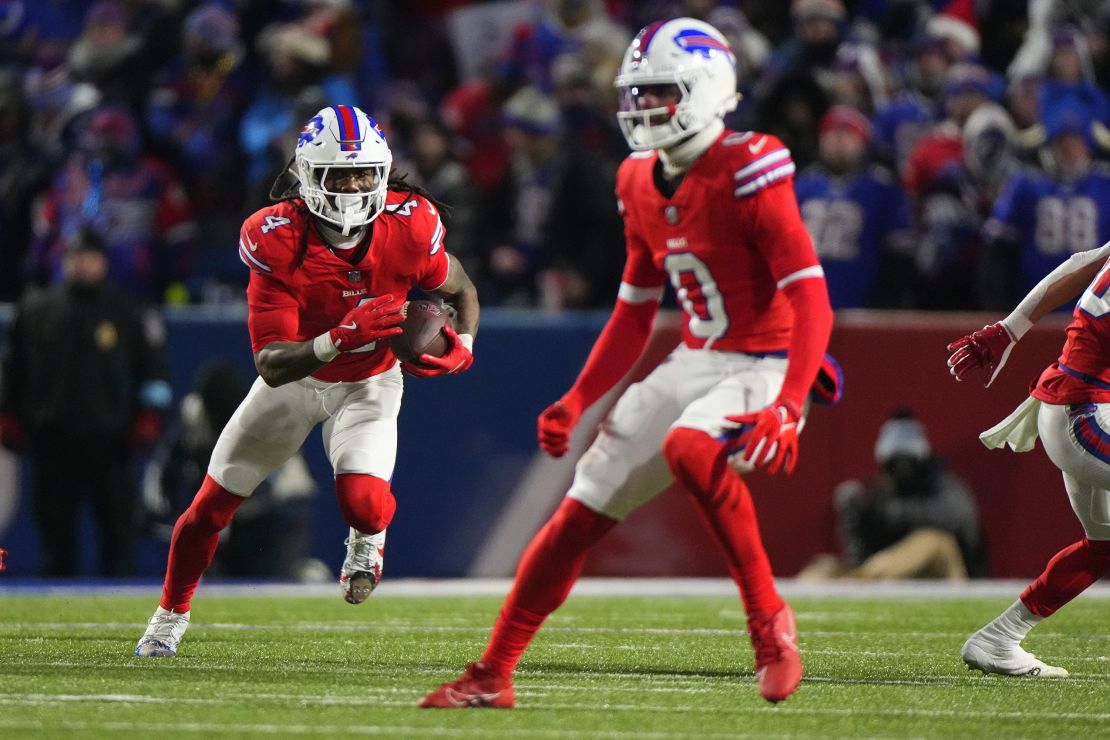 Dec 22, 2024; Orchard Park, New York, USA; Buffalo Bills running back James Cook (4) runs with the ball against the New England Patriots during the second half at Highmark Stadium. Mandatory Credit: Gregory Fisher-Imagn Images