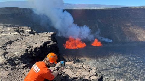 A U.S. Geological Survey Hawaiian Volcano Observatory geologist checks a webcam located on the rim of the caldera during a new eruption which began early at the Kilauea volcano in Hawaii, U.S. December 23, 2024.  USGS/M. Patrick/Handout via REUTERS. 
THIS IMAGE HAS BEEN SUPPLIED BY A THIRD PARTY

