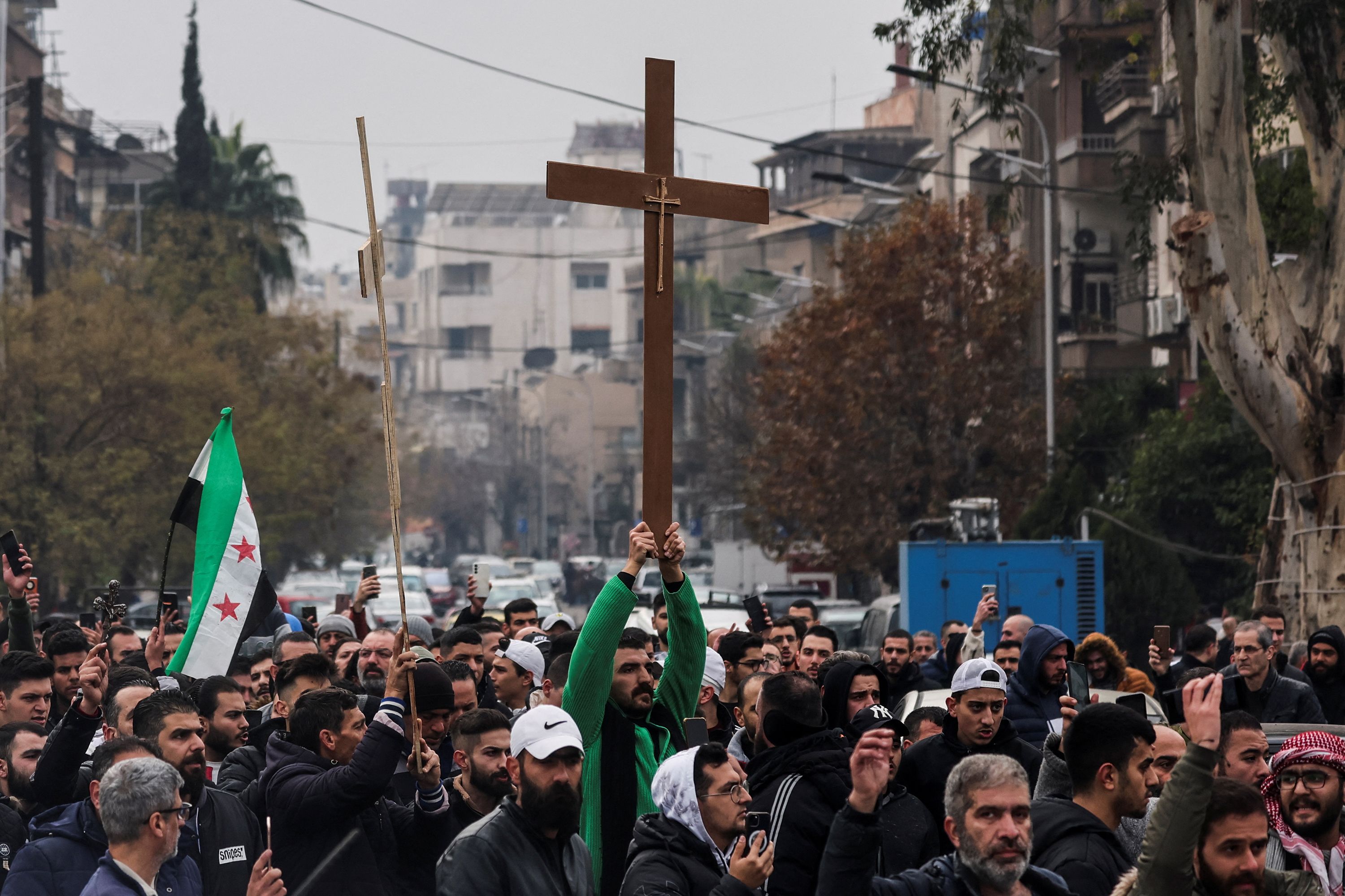 Christians protest in Syrian capital after burning of Christmas tree