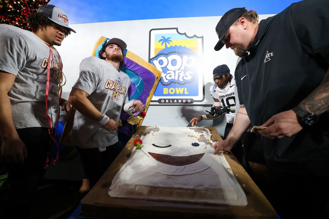 Iowa State players and coaches enjoy a cinnamon roll Pop-Tart after the win.