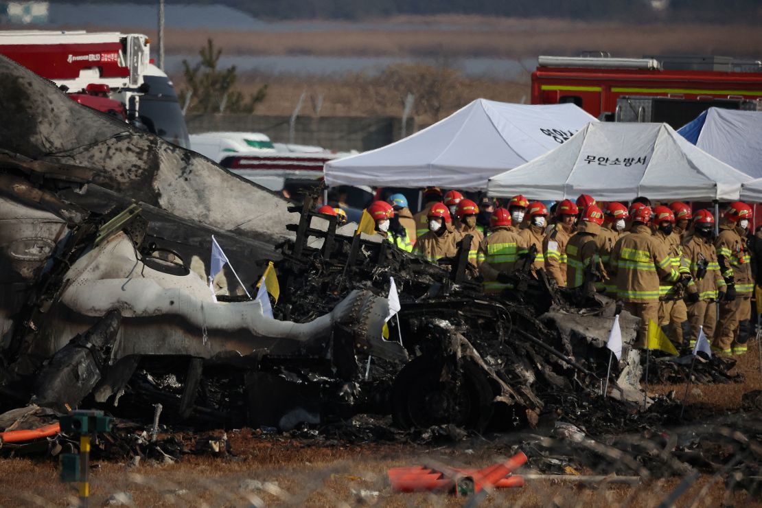 Rescue workers take part in a salvage operation at the site where an aircraft crashed after it went off the runway at Muan International Airport, in Muan, South Korea, on December 29, 2024.