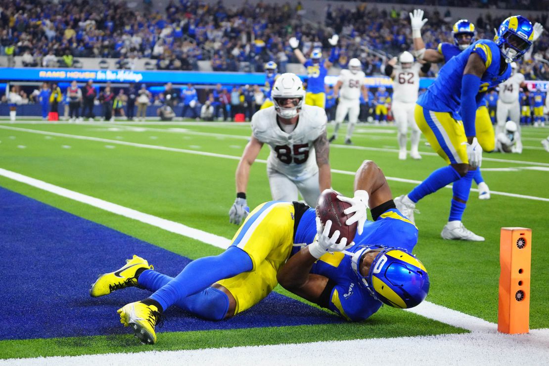 Los Angeles Rams cornerback Ahkello Witherspoon intercepts a pass late in the game to secure his team's win.