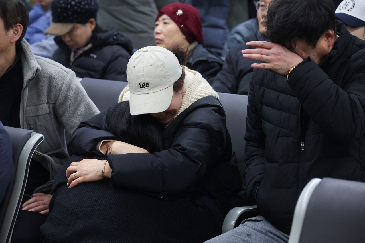 Relatives of passengers that were on the plane react at Muan International Airport in South Korea on December 29.